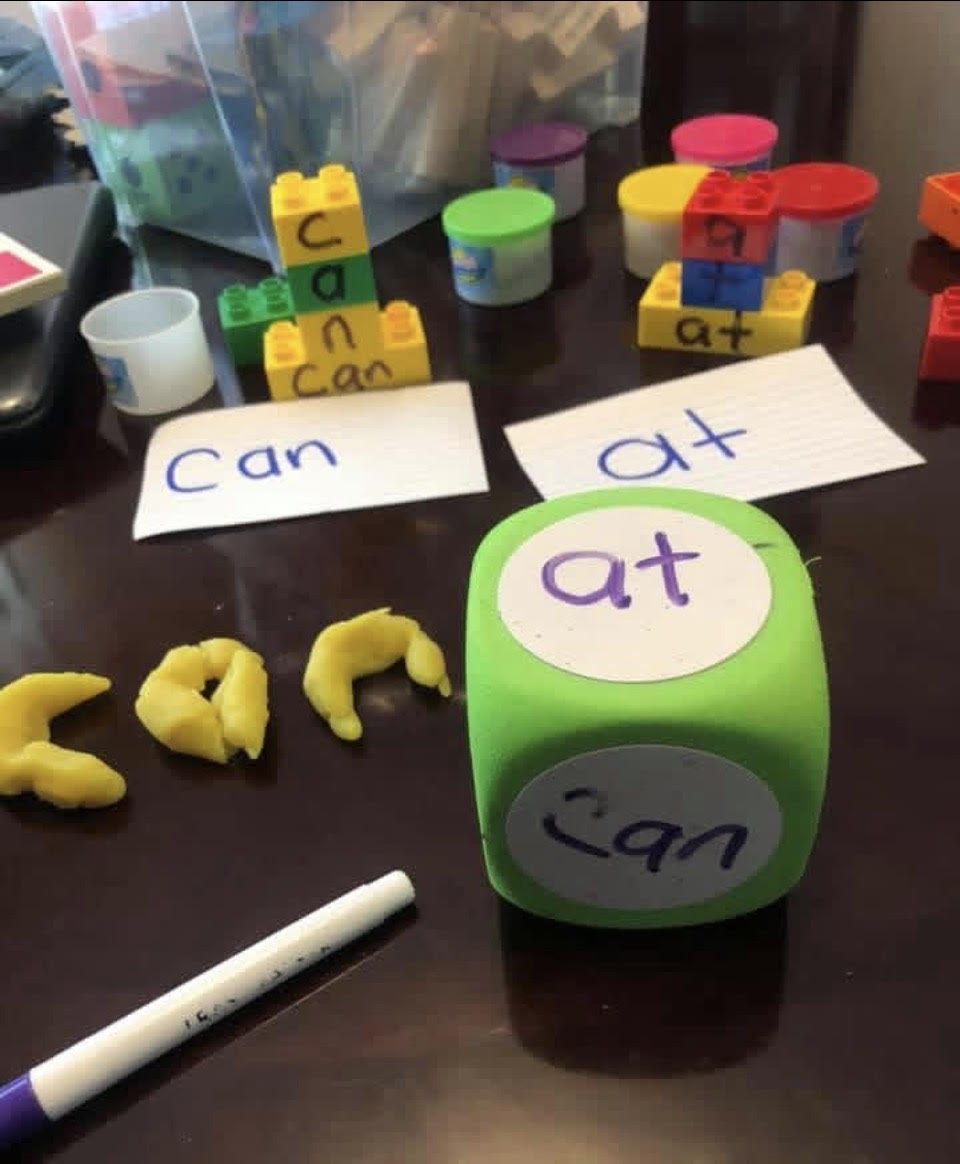 Preschool Learning in Havana, Florida | Teresa Delores Educational & Developmental Center Hands-on preschool literacy activity in Havana, Florida — sight words 'can' and 'at' explored with blocks, playdough, and word dice at Teresa Delores Educational & Developmental Center